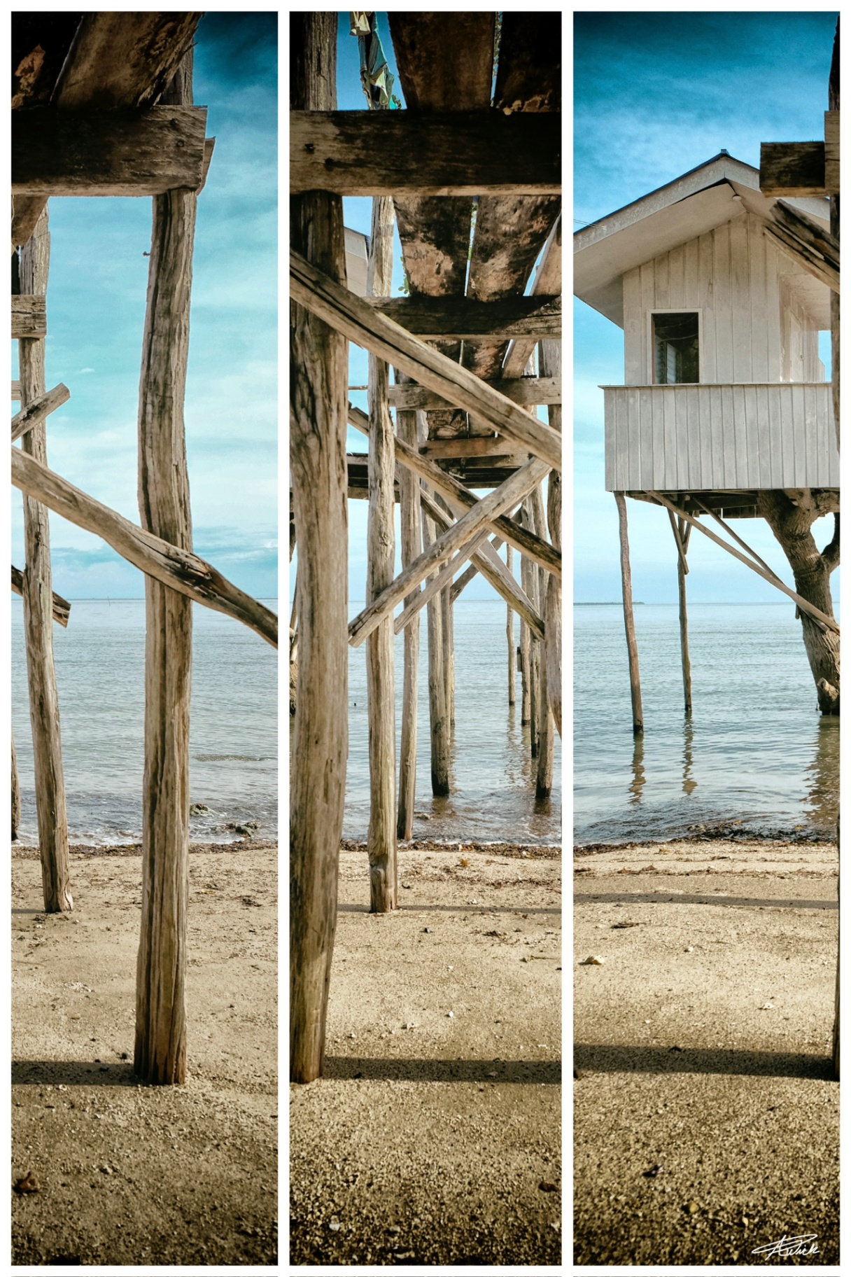 Three-panel composition of weathered stilt-house timbers, pale sand, still water and a white shore house beneath a clear blue sky