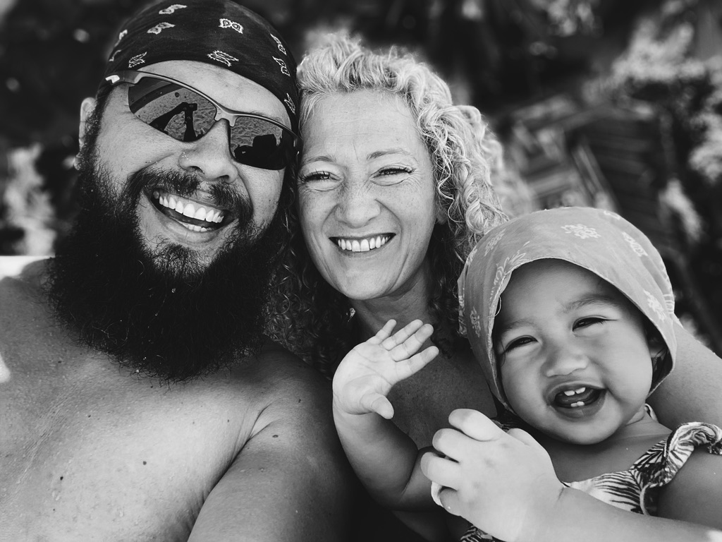 Alwood and Rosie Wick with one of their children, black and white family portrait in the Philippines